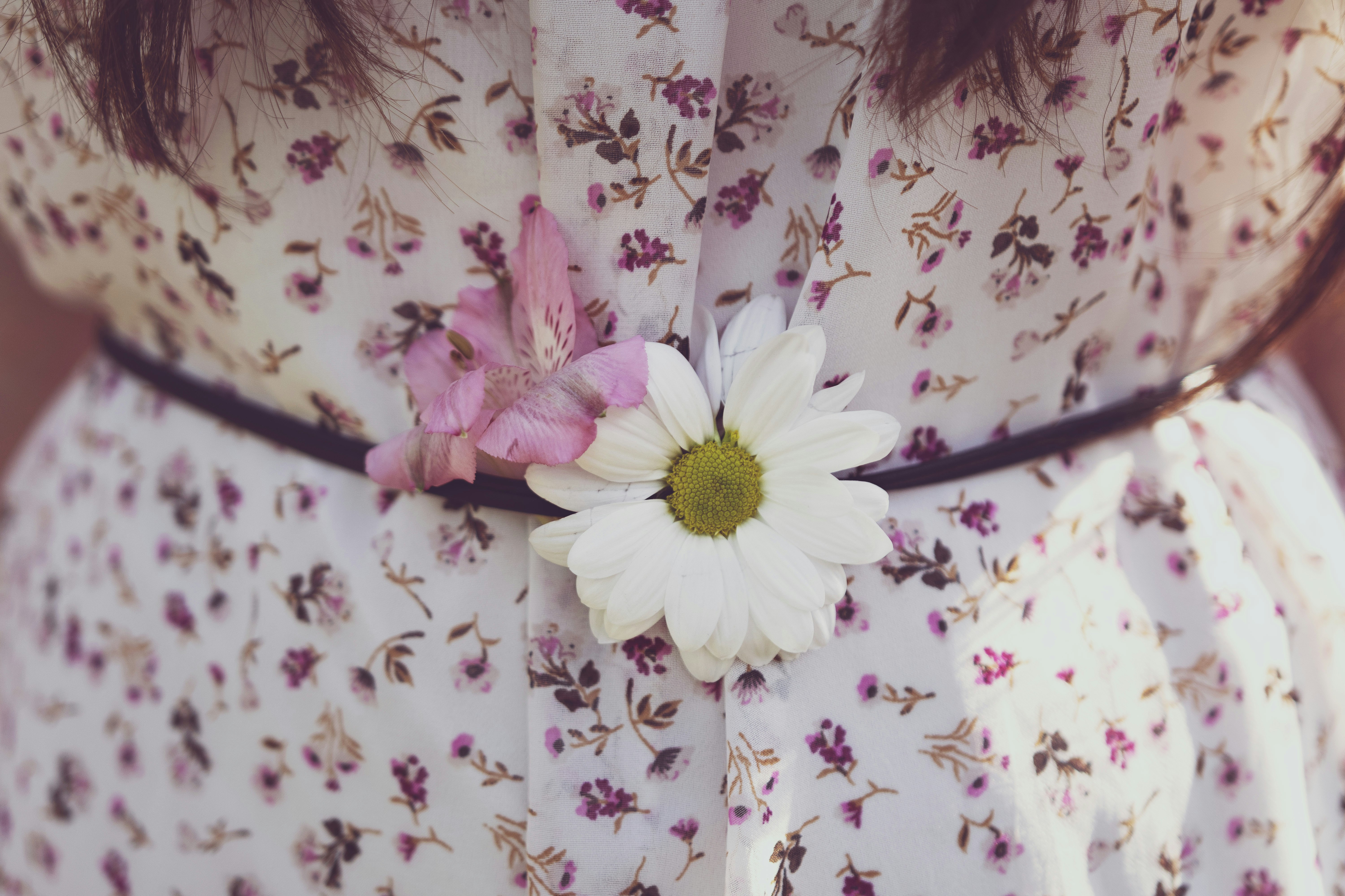 Blooms in the dress with a floral pattern.