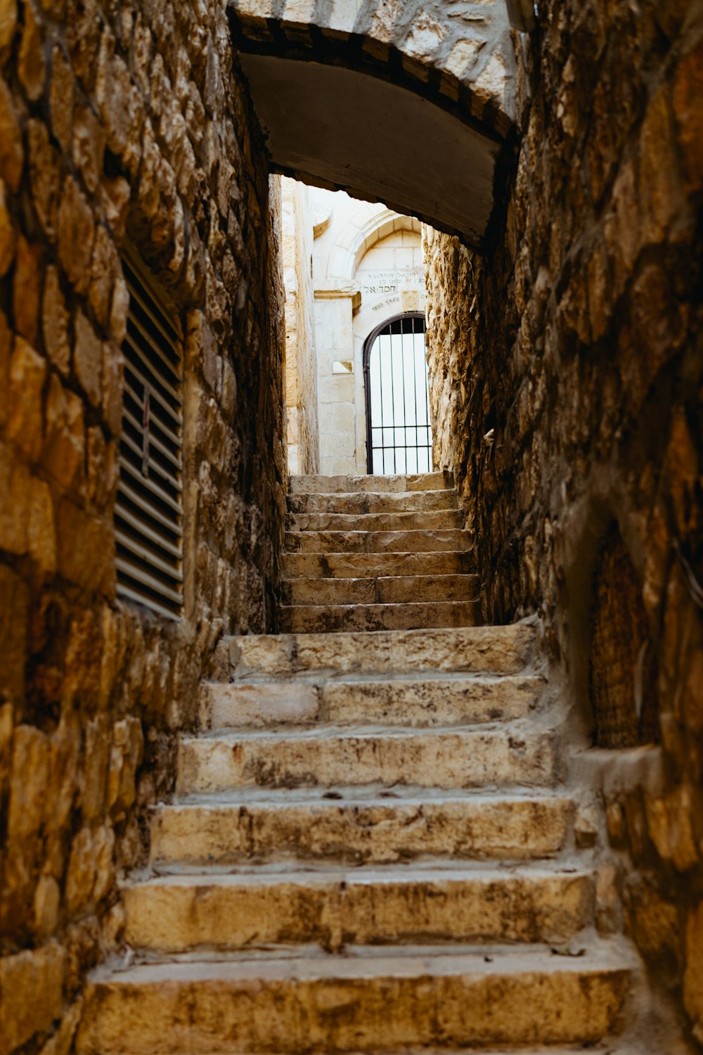 concrete stairs in between walls