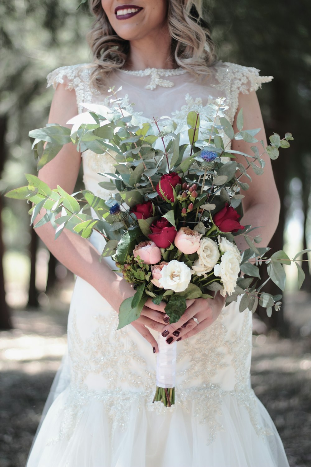 bride holding bouquet of flowers