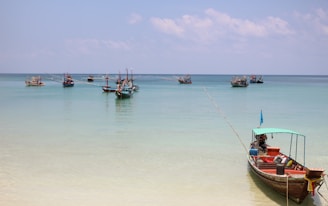 Traditional fishing boats bobbing gently in the turquoise waters near Galle