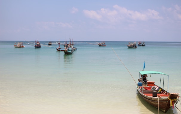 Traditional fishing boats bobbing gently in the turquoise waters near Galle