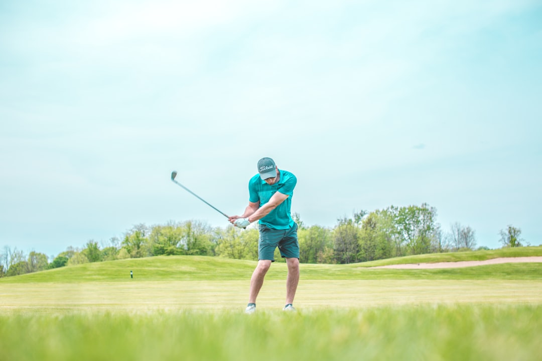 man playing golf,