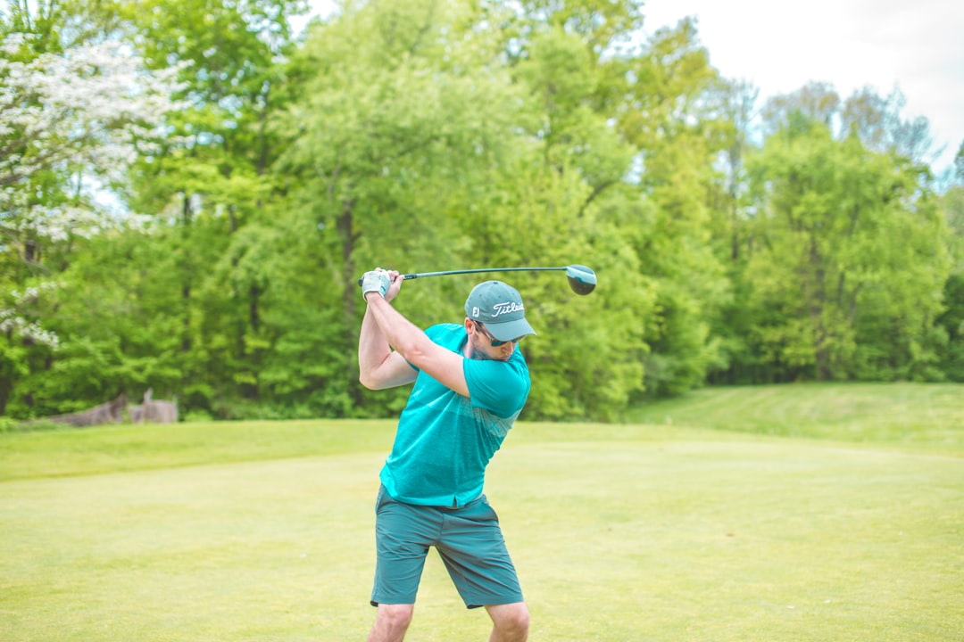 man striking golf ball,