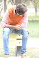 A sunny park bench with a smartphone displaying a positive review on screen