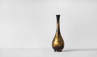 An elegant floor vase with a modern design, perfect for home decor.