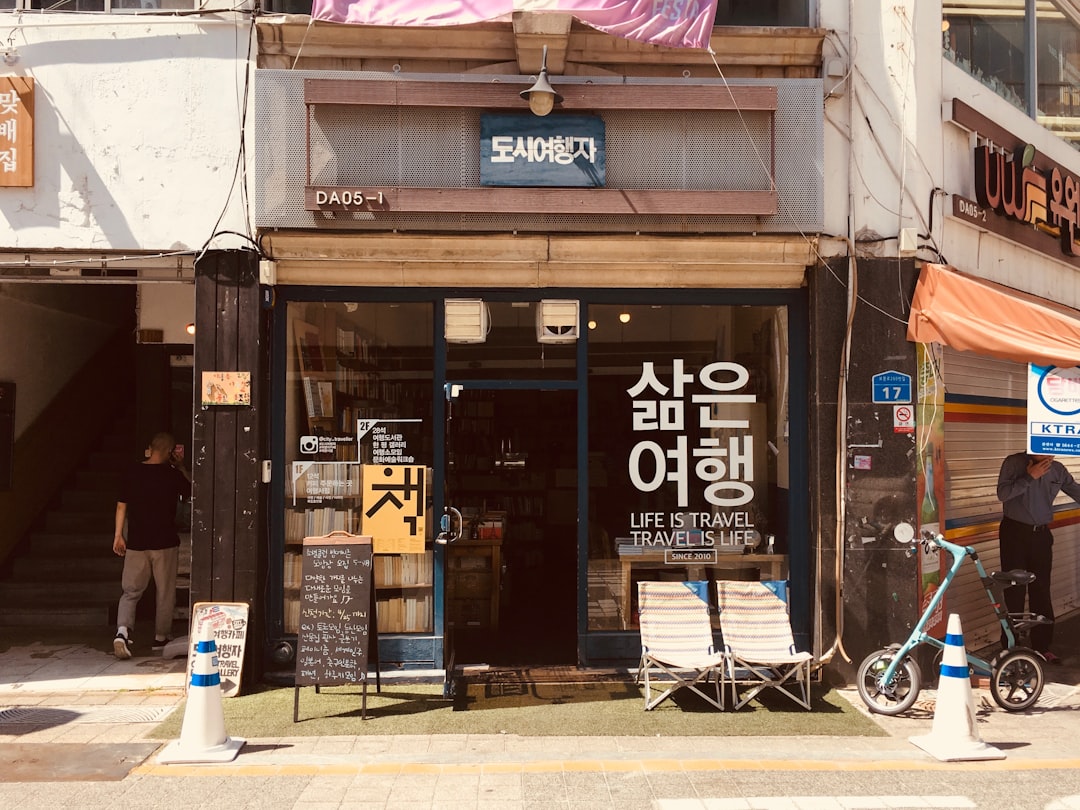 photography of bike near store facade, book store in deajeon
