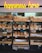 A variety of freshly baked bread arranged on wooden shelves in a bakery setting. A neon sign above reads 'happiness here.' The shelves are filled with different types of bread, including baguettes, round loaves, and seeded bread.