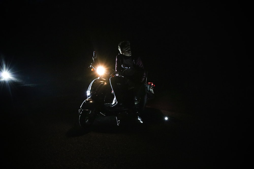 person sitting on motorcycle