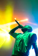 man singing while holding microphone