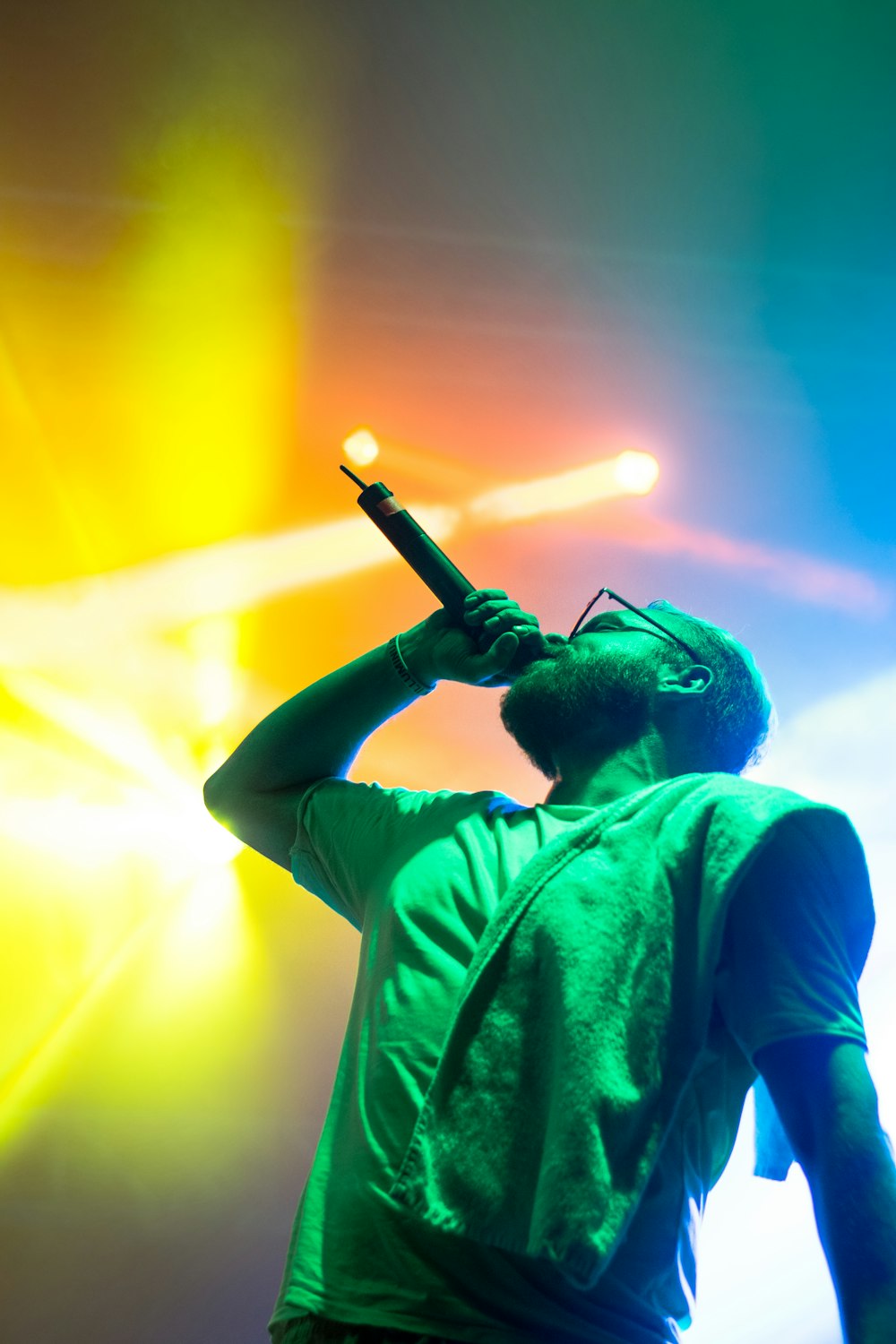 man singing while holding microphone