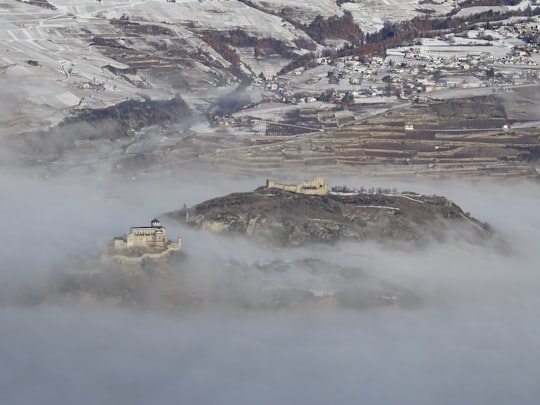 smoke covering green mountain in Sion Switzerland