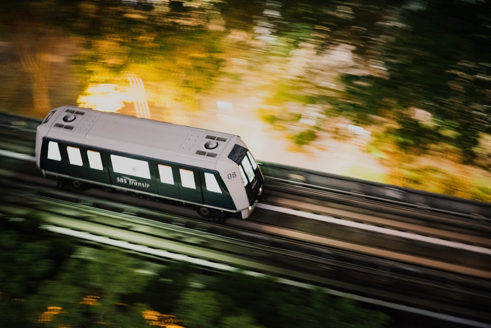 time lapse photography of white bus