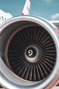 Close-up of turbine engine undergoing professional inspection by certified mechanic.