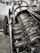 A close-up of a robust engine with detailed components, set against a neutral background.