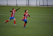 Children celebrating a sports victory, highlighting joy and camaraderie in youth athletics.