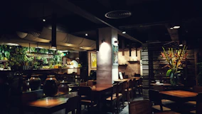 brown wooden chairs and tables on restaurant