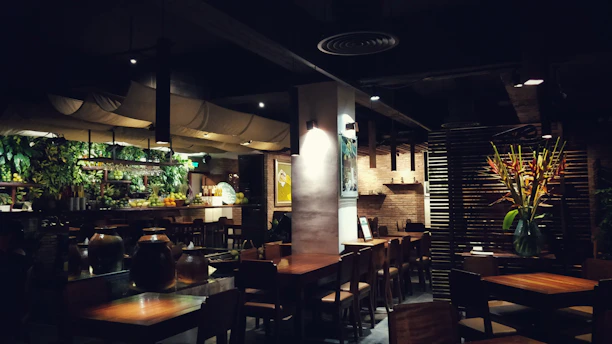 brown wooden chairs and tables on restaurant