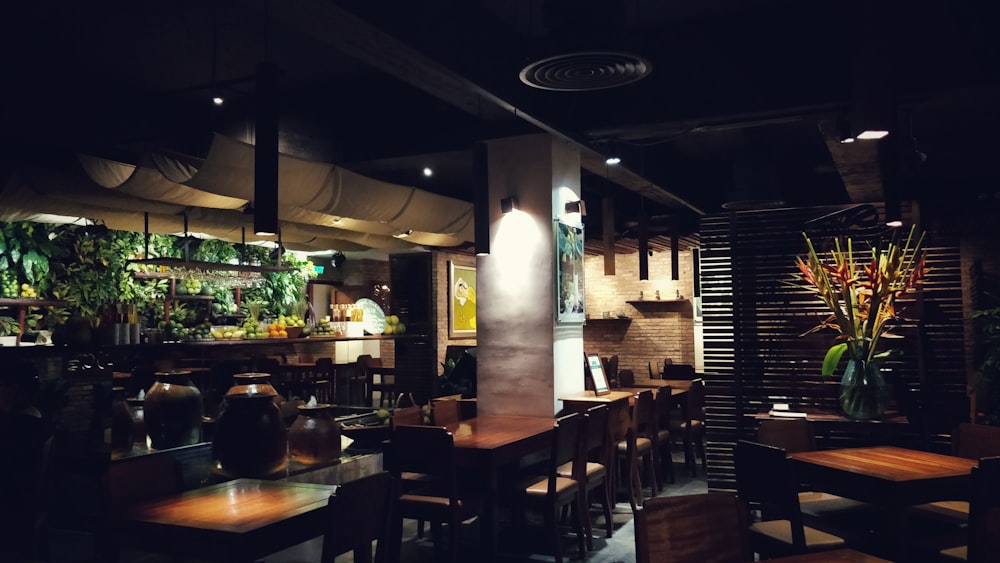 brown wooden chairs and tables on restaurant