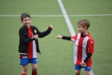 Children enjoying a friendly match at the youth camp.
