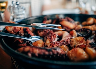 cooked octopus in black bowl