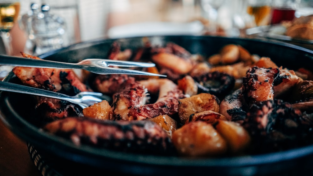 cooked octopus in black bowl