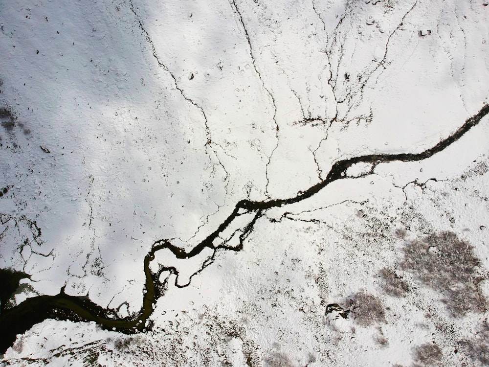 a river running through a snow covered field