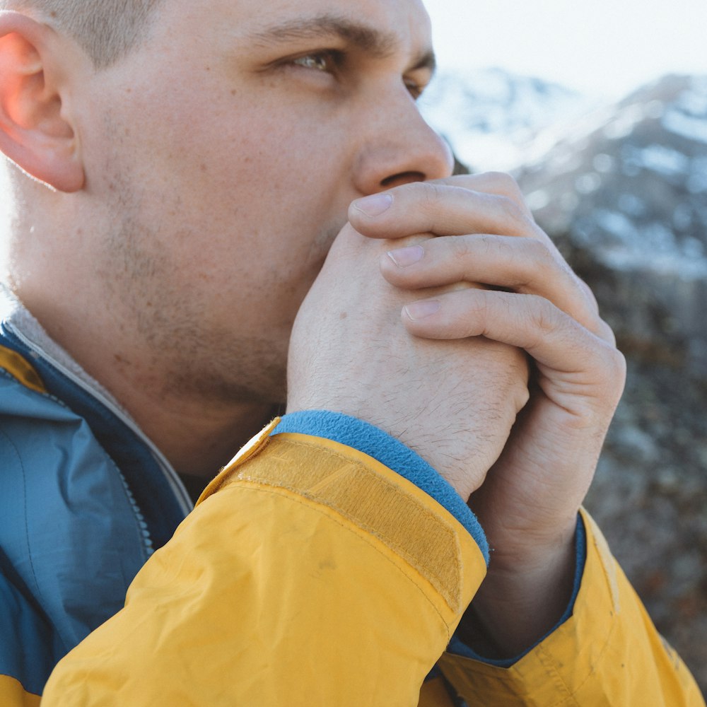 man holding his mouth