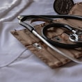 black stethoscope with brown leather case