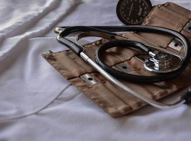 black stethoscope with brown leather case