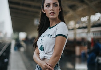 woman standing in front of train