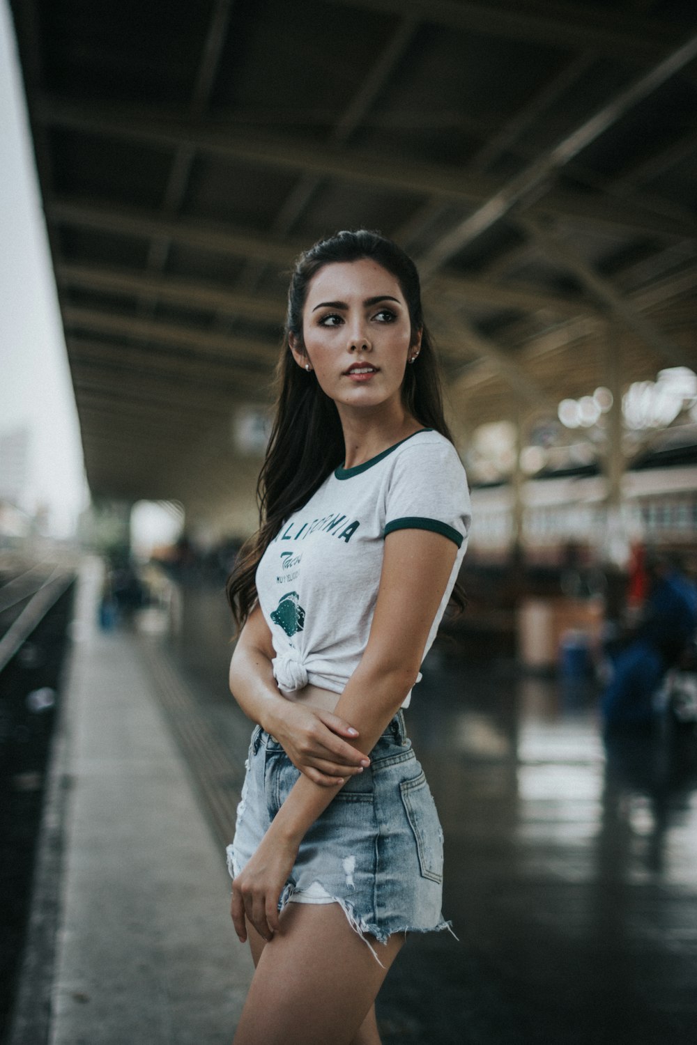 woman standing in front of train