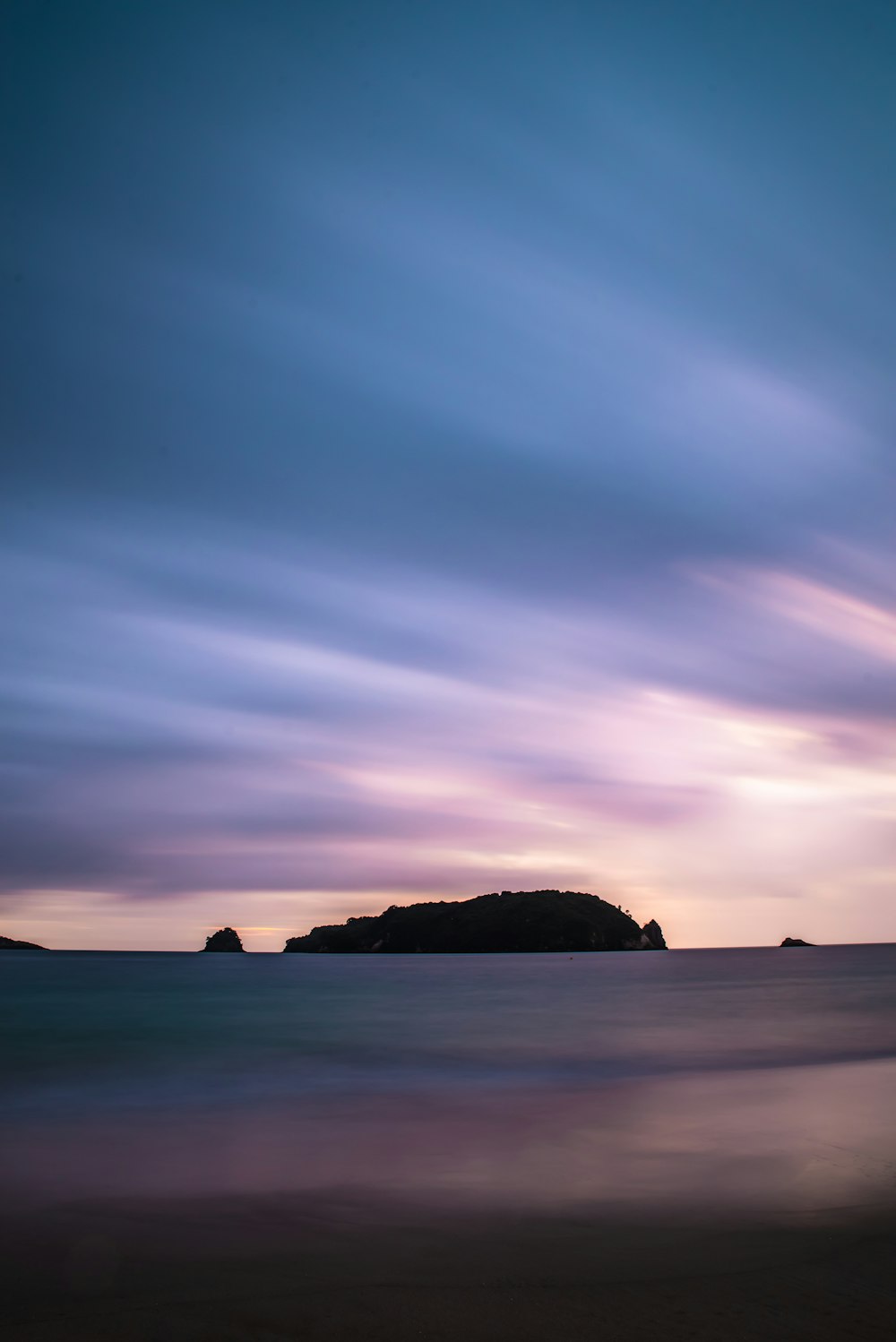 island under blue sky