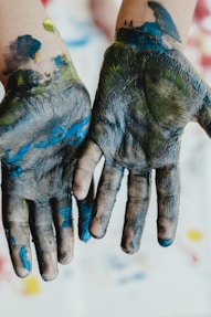 person hands with green paint