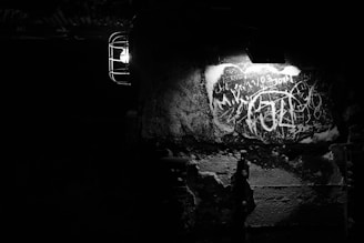 A close-up of neon-lit graffiti spelling 'CTF' on a dark brick wall with glitch effects.