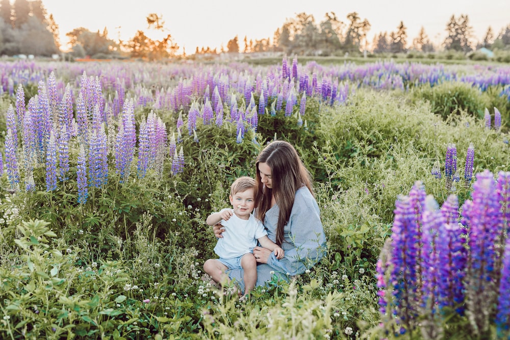 woman sitting surrounded by grape hyacinth