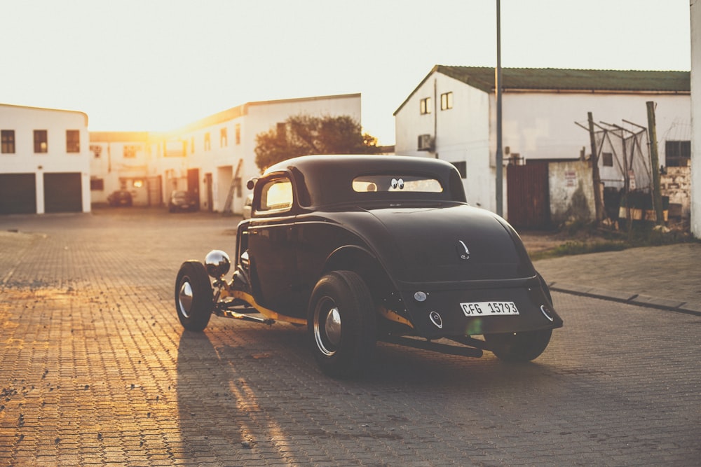 vintage black car on road during daytime
