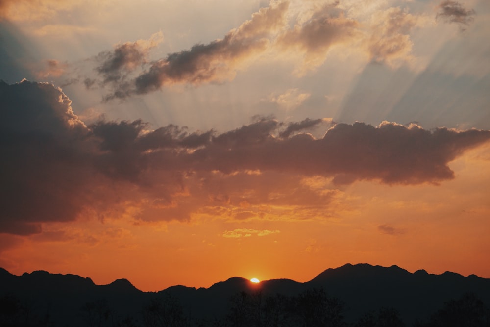 silhouette of mountain during golden hour