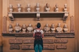 woman watching statues