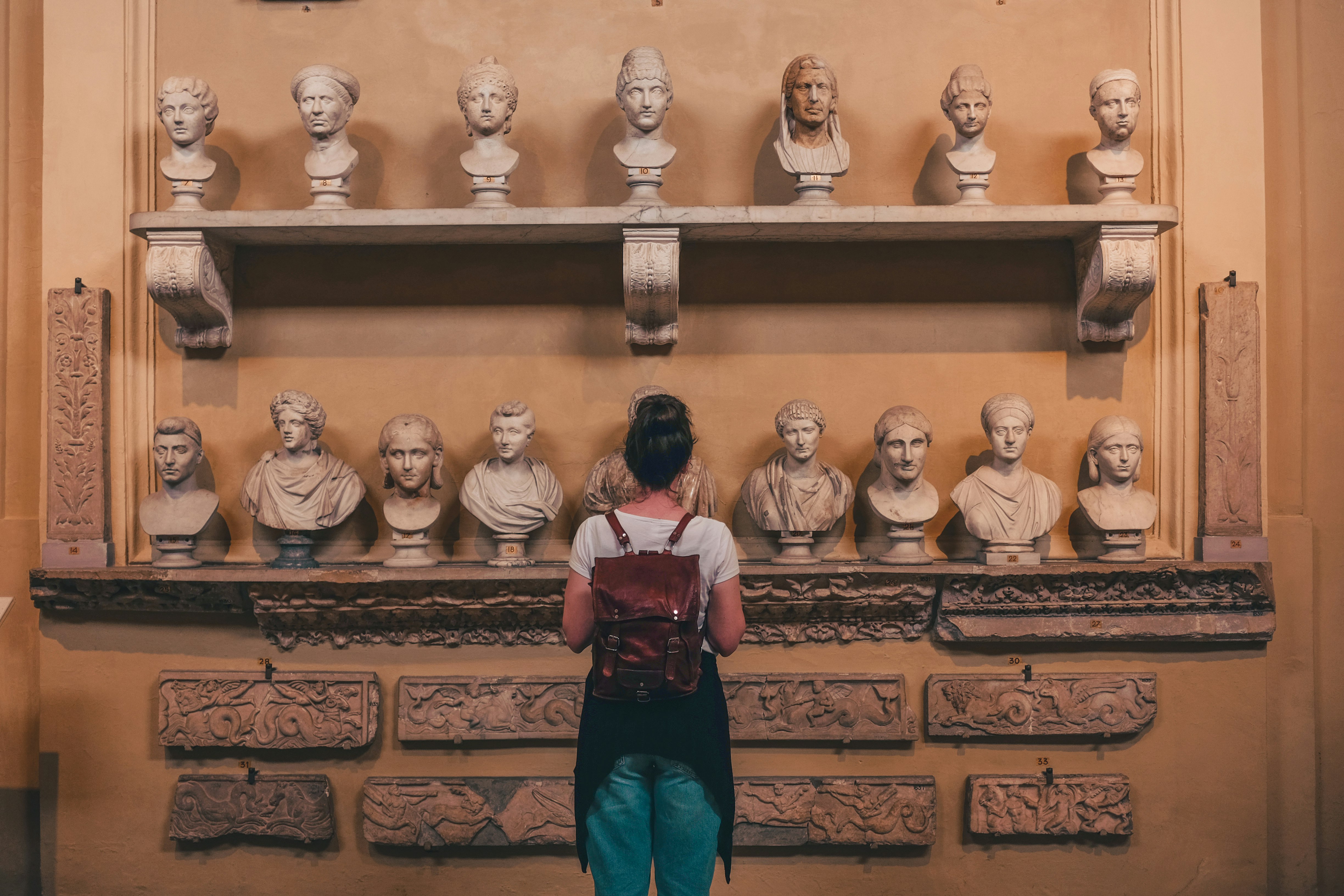 woman watching statues