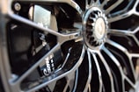 Close-up of a polished car wheel showcasing intricate design.