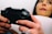 A close-up of a person playing a video game with intense focus and excitement.