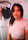 Happy woman recording voiceover in a professional studio