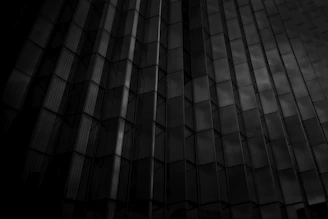 Abstract geometric shapes overlaying a courthouse facade.