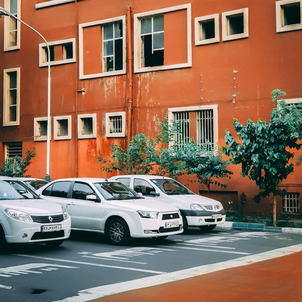 three cars on asphalt roas