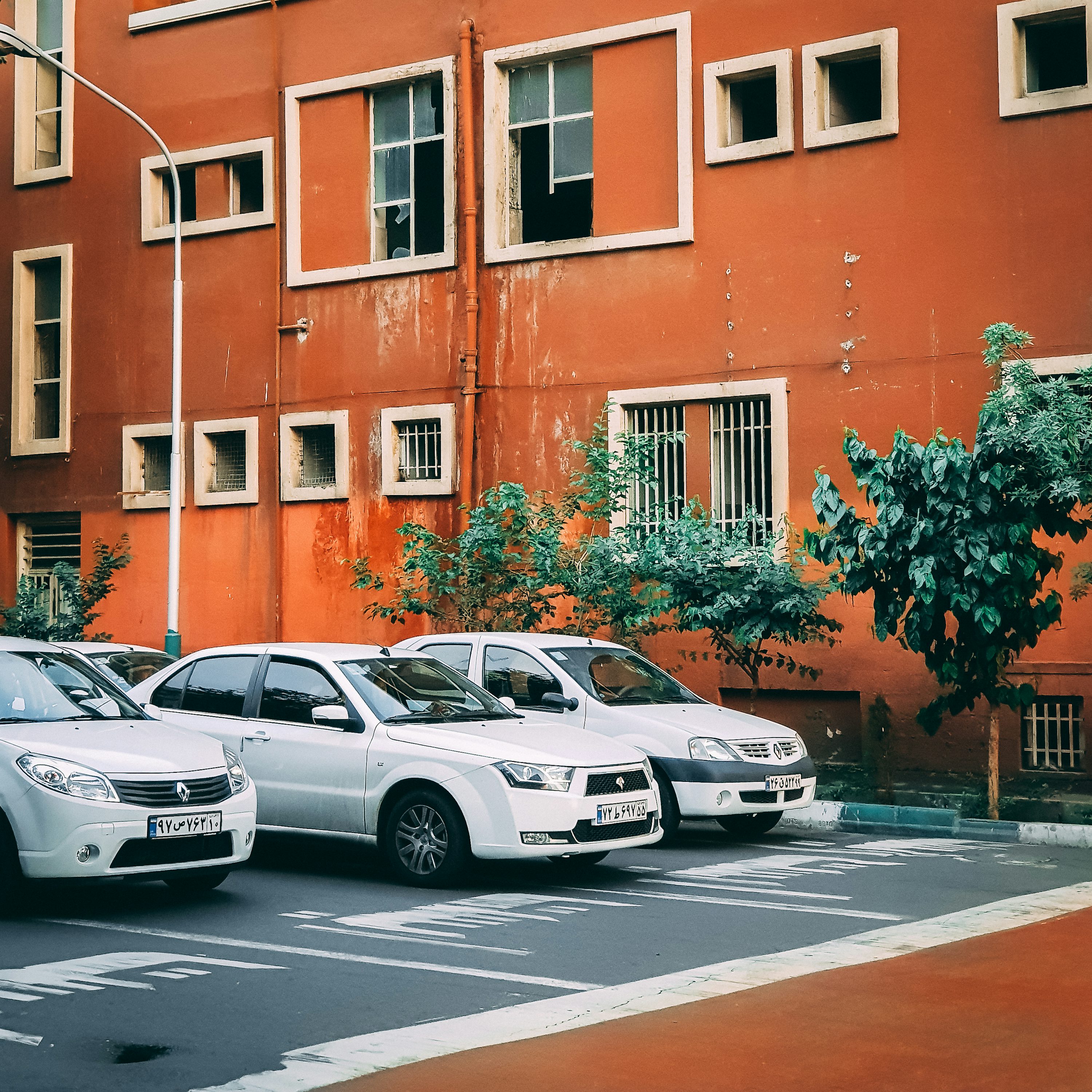 three cars on asphalt roas