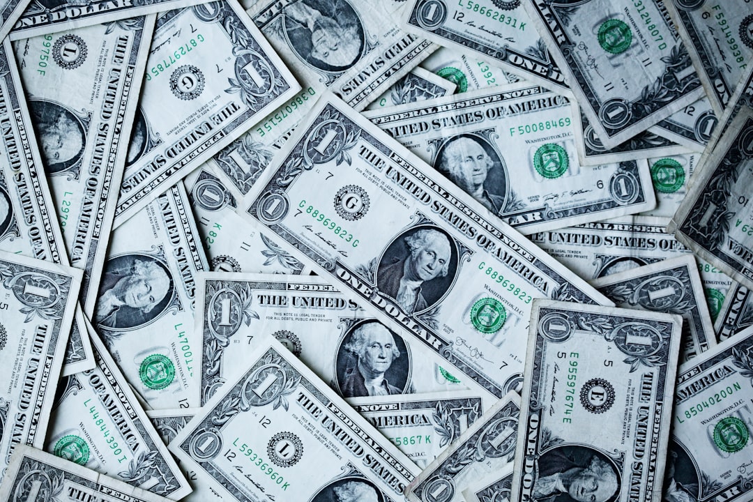 A collection of US Dollar bills make an interesting financial wallpaper.