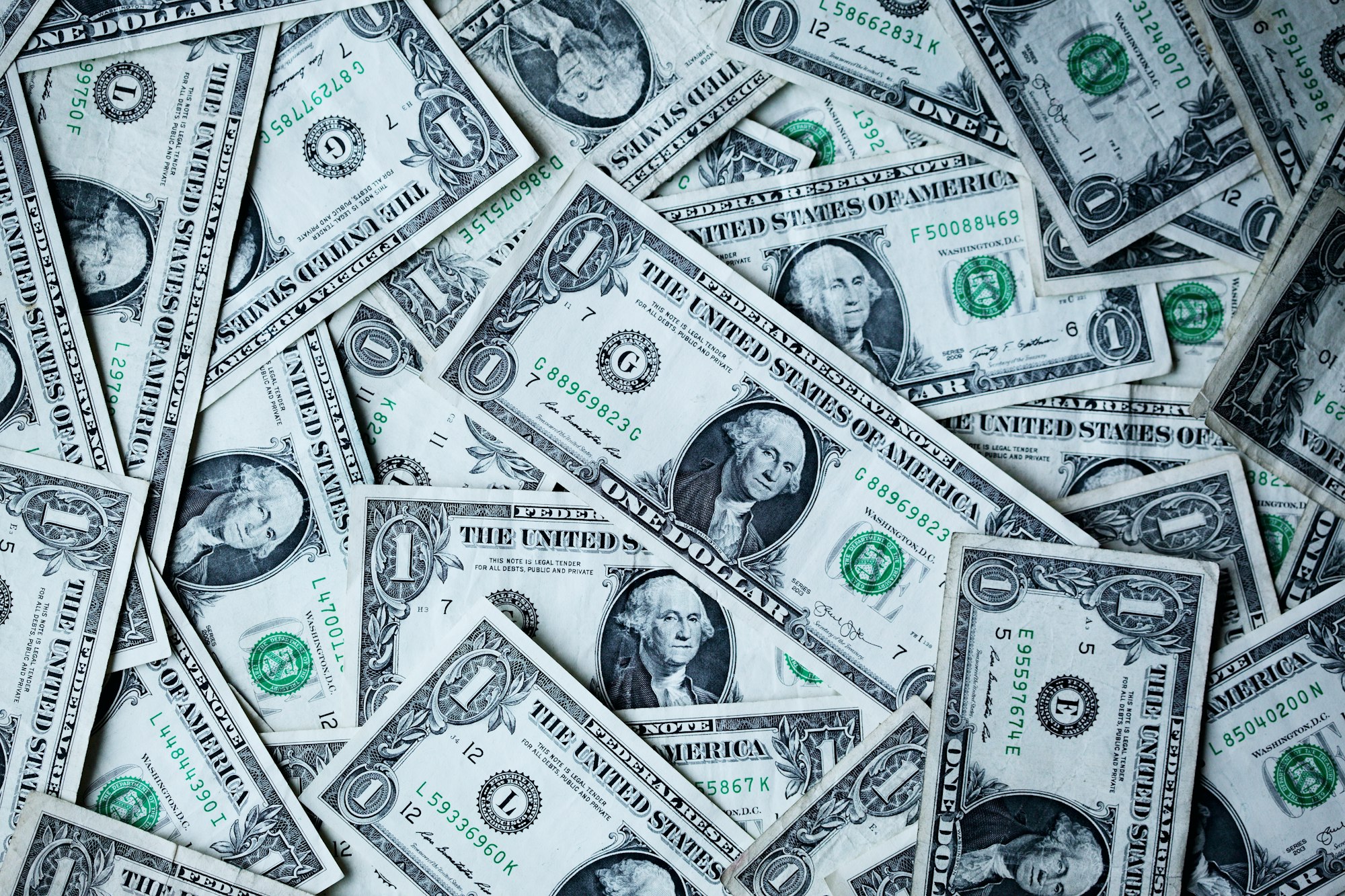 A collection of US Dollar bills make an interesting financial wallpaper.
