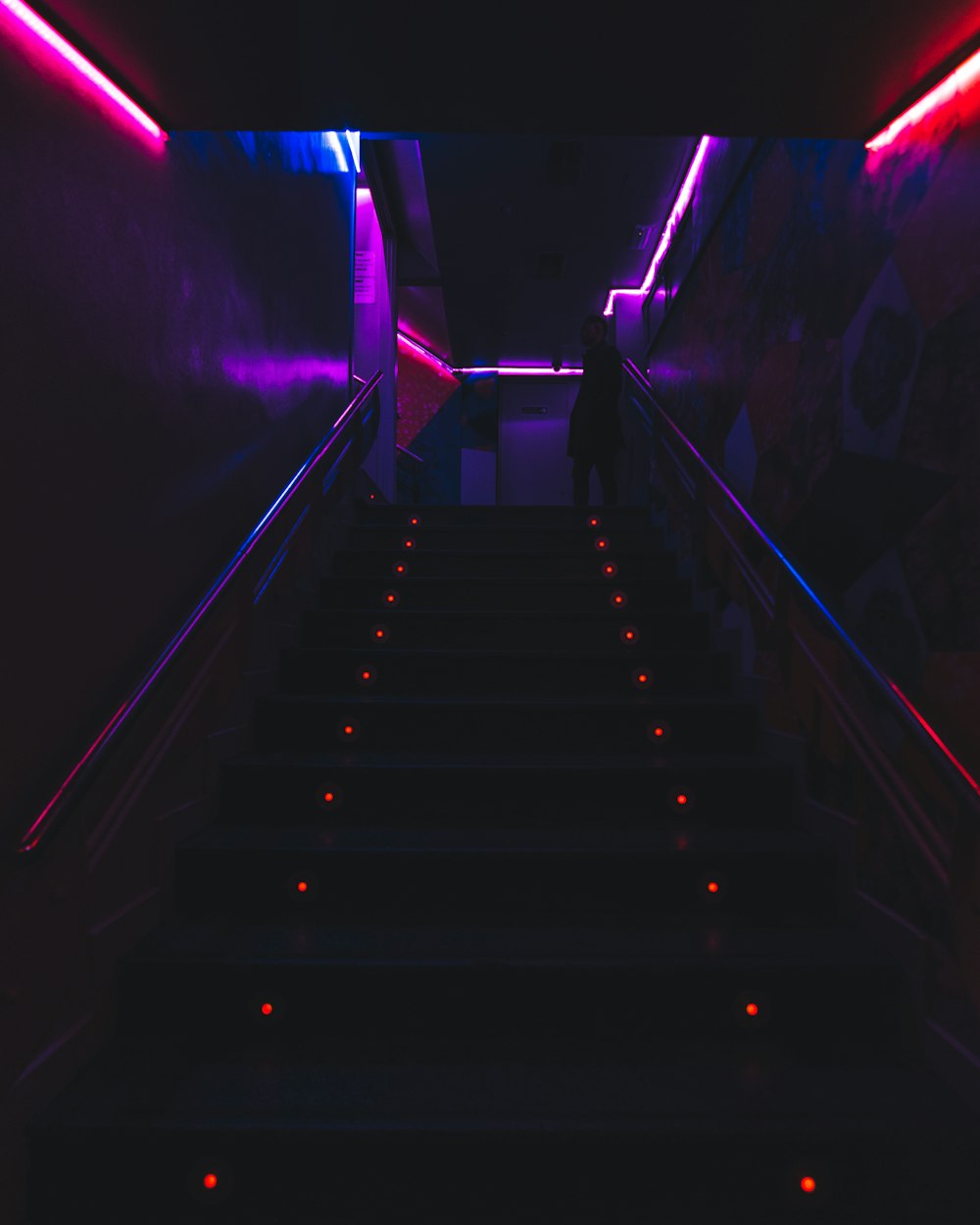 black and white staircase with purple lights