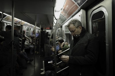 Passengers enjoying a quiet moment while charging their devices.