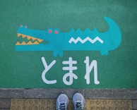 teal crocodile painted ground